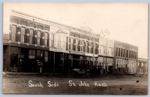 K29/ St John Kansas RPPC Postcard c1910 South Side Stores Main St 255