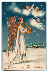 1909 Christmas Greetings Angel Lyre Cherubs Head Stars Embossed Antique Postcard