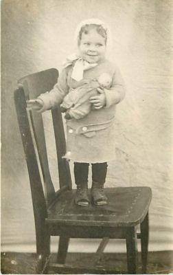 REAL PHOTO-SMILING LITTLE GIRL HOLDING DOLL-CHUBBY CHEEKS...