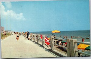 Postcard VA Virginia Beach woman walking next to beach