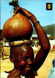 VINTAGE CONTINENTAL SIZE POSTCARD BEER IN PUMPKIN CARRIED BY RWANDAN WOMAN STAMP