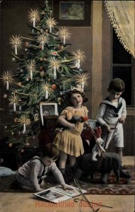 Christmas Children Reading Book Toys Gel Coat c1900s-20s Postcard