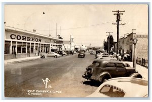 Tijuana Mexico Postcard RPPC Photo AV C Avenue Correos Telegrafos Farmacia Cars