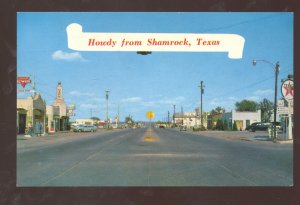 HOWDY FROM SHAMROCK TEXAS ROUTE 66 GAS STATION STREET SCENE VINTAGE POSTCARD
