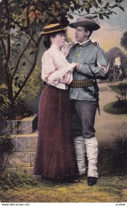 A soldier and his lady standing together, 1900-10s