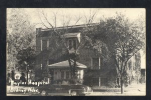 RPPC SIDNEY NEBRASKA TAYLOR HOSPITAL BUILDING OLD CARS REAL PHOTO POSTCARD