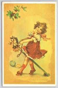 Vintage Postcard 1976 Merry Christmas Greetings Little Girl Riding a Toy Horse