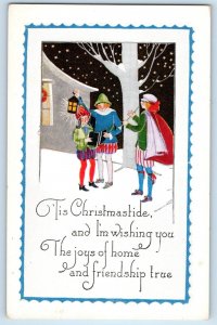 Christmas Postcard Children Caroling Snow Winter Scene Embossed c1910's Antique