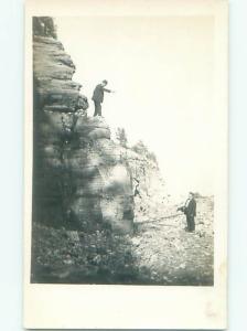 rppc 1920's MAN LOOKING DOWN FROM THE ROCKS AT HIS FRIEND AC8466