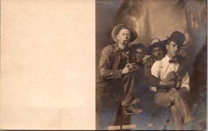 Real Photo Postcard Four Young Men Wearing Hats Smoking Cigars in Photo Studio