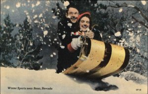 Reno Nevada NV Winter Sports Couple Sledding Linen Vintage Postcard