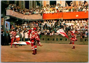 VINTAGE CONTINENTAL SIZE POSTCARD THE TRADITIONAL GAME OF THE FLAG SIENA ITALY