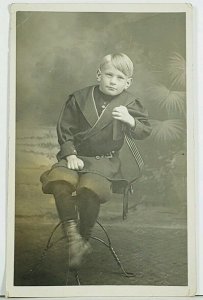 RPPC Sweet Little boy in his Knickers Seated on Unique Iron Chair Postcard A2