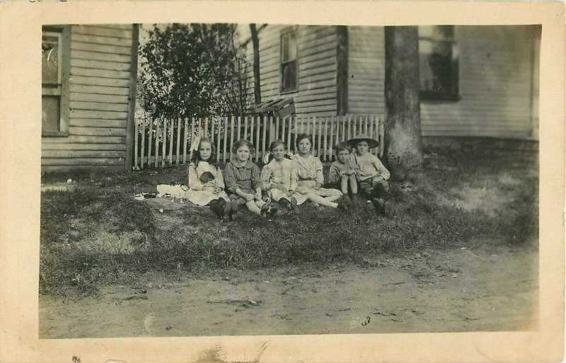 Vintage Postcard RPPC Children Sitting In Yard