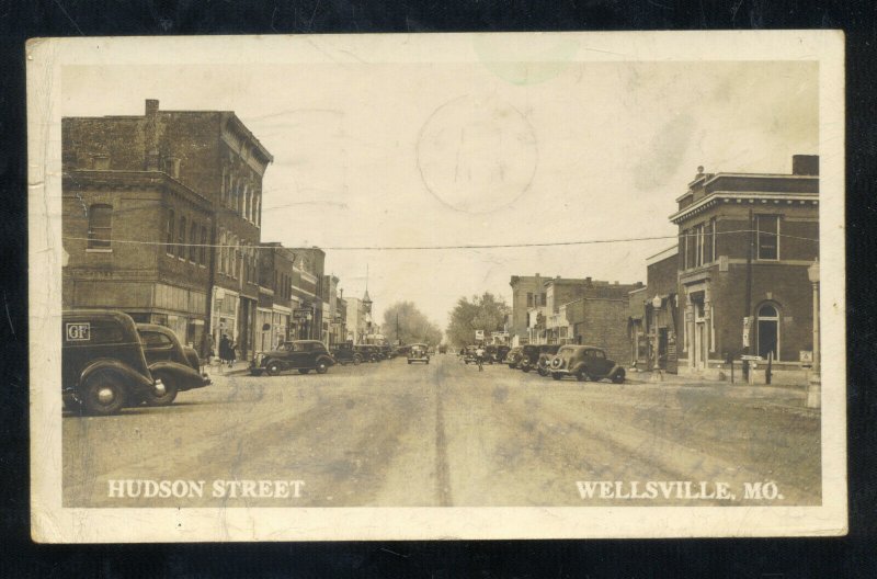 RPPC WELLSVILLE MISSOURI DOWNTOWN HUDSON STREET SCENE REAL PHOTO POSTCARD CARS