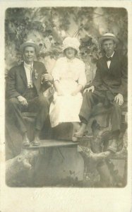 C-1910 Studio Photo Two men woman Kunselman  RPPC Photo Postcard 22-412