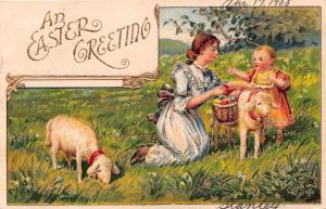 EASTER GREETING~LAMBS~WOMAN WITH BABY~BASKET OF COLORED EGGS~GILT POSTCARD 1908