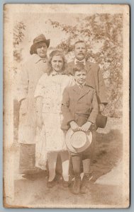 Postcard RPPC c1910s Four People Photo Of A Family Hats