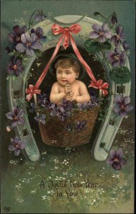 EAS New Year Little Boy Baby in Basket Smoking Pipe c1910 Postcard