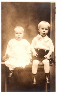 Babies sitting on bench