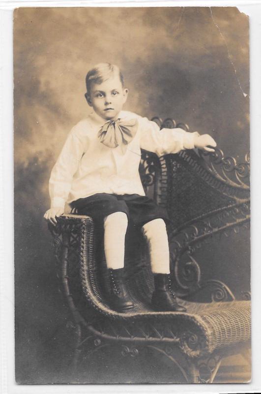 Antique RPPC Real Photo Postcard Small Boy Formal Clothes Boots Neck Bow Chair