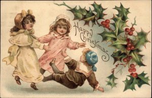 Christmas Little Boy and Girls Playing Holly Border c1910 Vintage Postcard