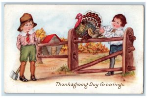 c1910's Thanksgiving Greetings Boys Ax Cached Turkey Embossed Antique Postcard