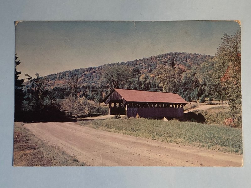 (1958) postcard of a covered bridge in New England