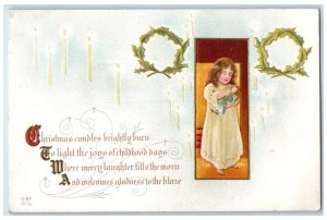 c1910's Christmas Girl Playing Doll Candle Lights Embossed Antique Postcard