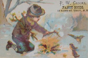 1870s-80s P W Crooks Fancy Goods Kid Playing in Snow Victorian Trade Card F35