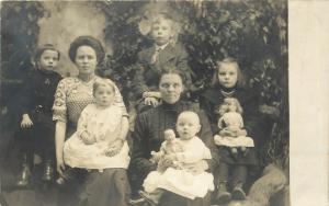 c1910 RPPC 3 Generations Family Portrait Women Children & their Dolls Unknown US