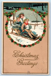 Christmas Greetings Children Sled Handwarmer Holly Berries Embossed Postcard