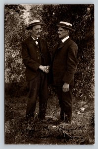 RPPC Two Men Wearing Boater Hats Shake Hands by Trees VINTAGE Postcard 1369