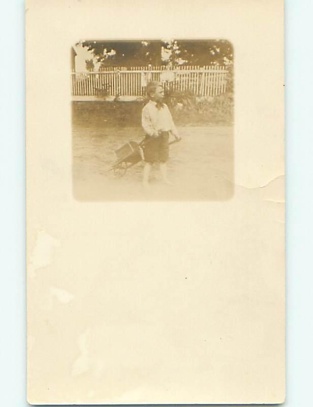 Pre-1918 rppc BOY PULLING CHILD SIZED WHEELBARROW r6013