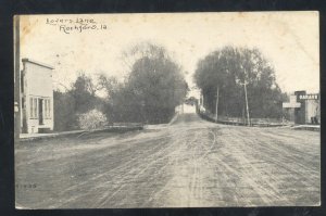 ROCKFORD IOWA DOWNTOWN DIRT STREET SCENE BRIDGE VINTAGE POSTCARD 1910