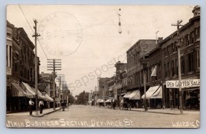 DC1/ Leipsic Ohio RPPC Postcard c1910 Defiance St Stores Ottawa Putnam 154