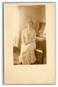 Vintage 1910's RPPC Postcard - Woman in White Dress Sitting at Upright Piano