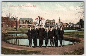 1910's WILMINGTON DELAWARE TENTH STREET PARK BOYS AT IRON FENCE POSTCARD