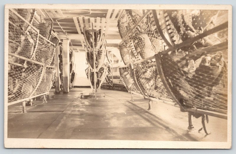 WWI Navy Ship Interior~Sailor Rack Bunks Folded Up~Stuff Inside~c1918 RPPC 