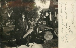 1908 RPPC Young Men Musicians on Sidewalk, Lakeside Band posted Bellefontaine OH