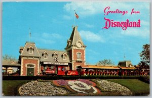 DISNEYLAND Anaheim California 1974 Postcard Floral Mickey Entrance Train Depot