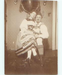 rppc 1920's WOMAN SITTING ON LAP OF MAN AC8509