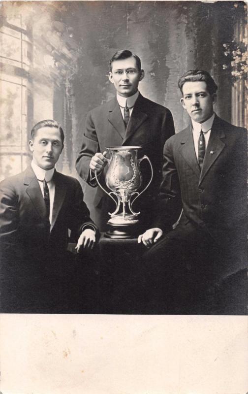 MEN WITH LOVING CUP~READS ...GUILD SOCIETY CLUB...~REAL PHOTO POSTCARD 1911