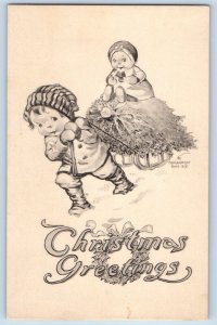 Signed Artist Postcard Christmas Greetings Boy Pulling Cart Winter c1910's