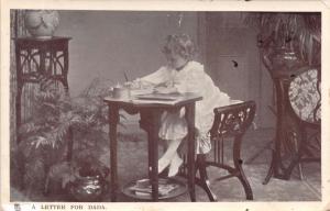 YOUNG GIRL WRITING LETTER FOR DADA~TUCK MOTHER'S DARLING GLOSSO POSTCARD 1907