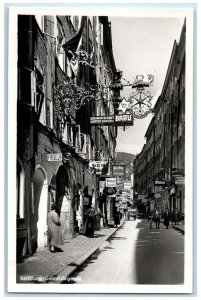 c1950's Getreidegasse Shopping Street in Salzburg Austria RPPC Photo Postcard