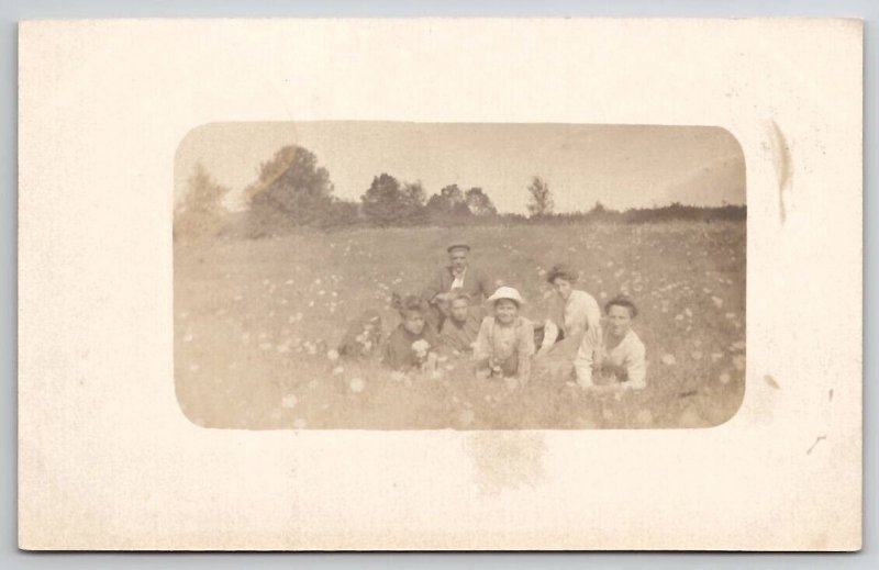 RPPC Ladies And Men Posing In Field of Flowers Photo Postcard V22