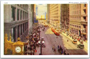 VINTAGE POSTCARD STATE STREET SCENE AT CHICAGO ILLINOIS TRAMS CLOCK SIGNAGE 1930