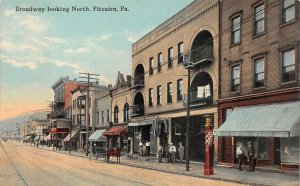 BROADWAY LOOKING NORTH PITCAIRN PENNSYLVANIA HARDWARE STORE POSTCARD (c. 1910)