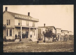 REAL PHOTO ABILENE KANSAS DOWNTOWN DIRT STREET SCENE STORES OSTCARD COPY